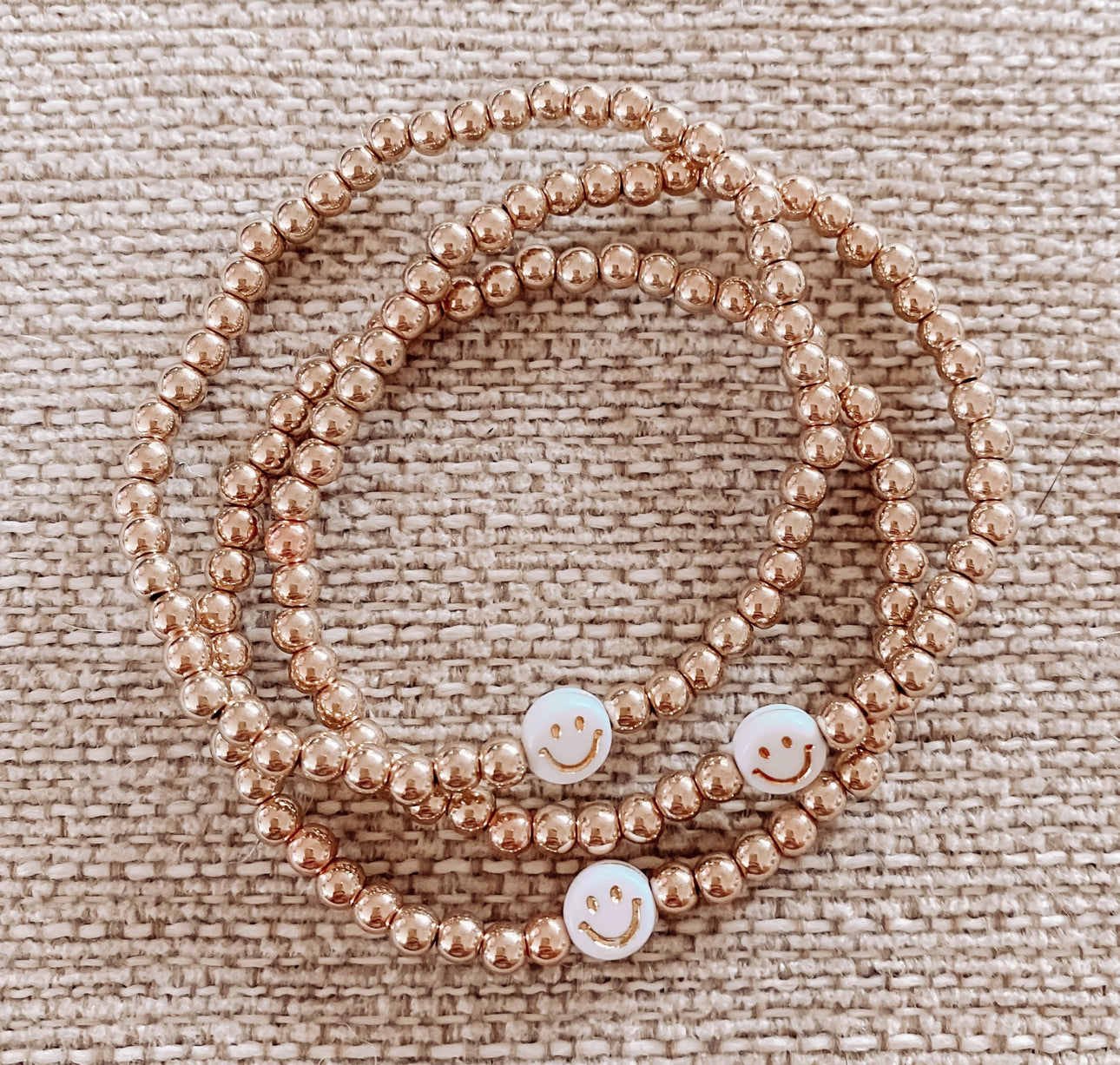 Gold beaded smiley face bracelets