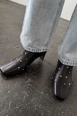Black studded boots by NFD